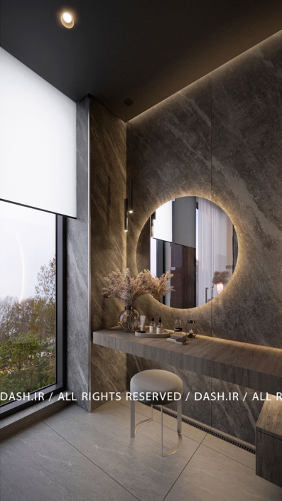 سرویس بهداشتی ویلا رویان سرویس بهداشتی مدرن با آینه دایرهای نورانی و سنگ تیره.